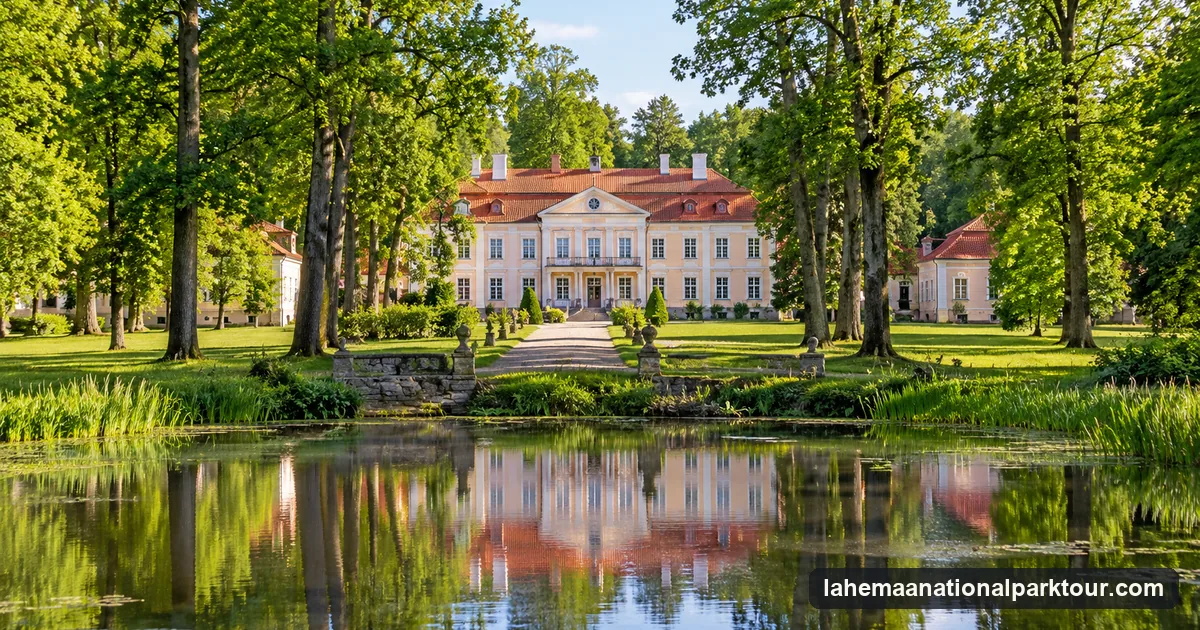 A pale manor house with a red roof reflected in a pond in the Estonian countryside